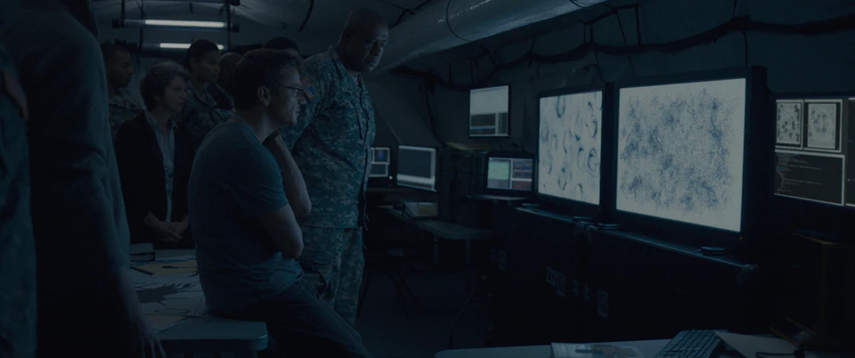 The Arrival surveillance tent set with maps and monitoring applications on its screens.
