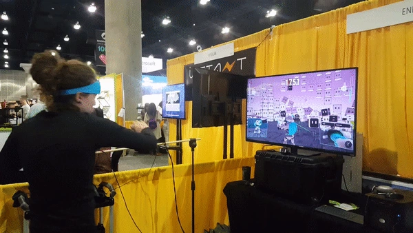 A live demonstration of Enflux motion capture clothing at a trade show.